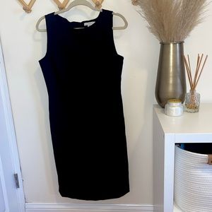 Sleek black shift dress, perfect for professional work settings. Size 10